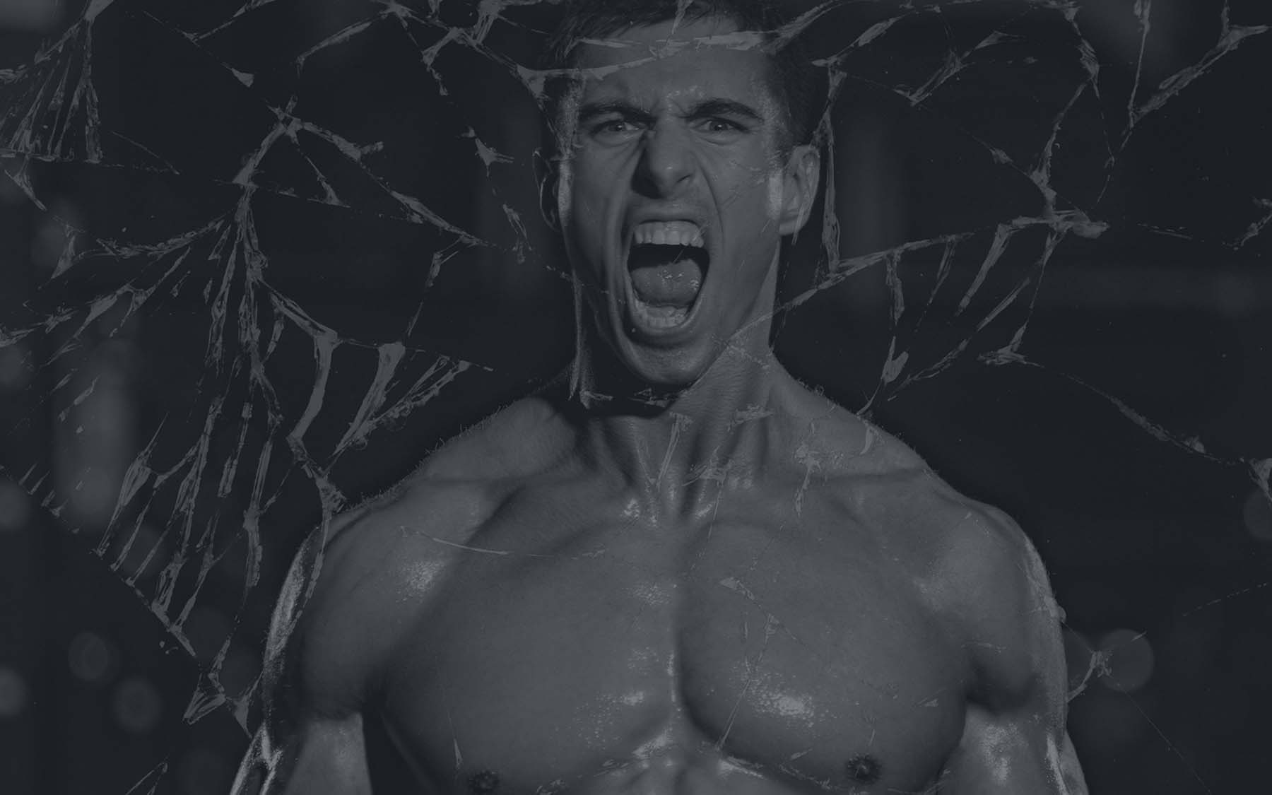 A bodybuilder customer from Ocala Nutrition screaming in a black background.